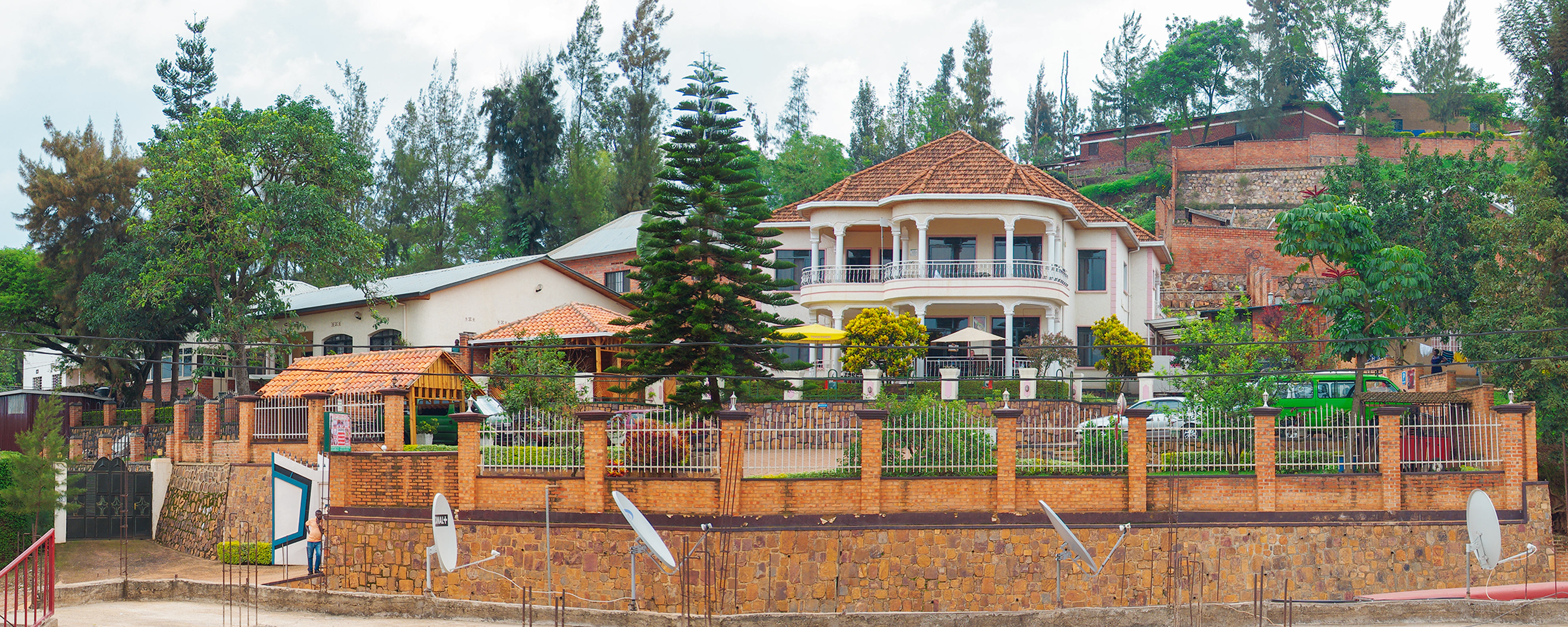 Step Town Hotel exterior with terracotta roofs and lush gardens